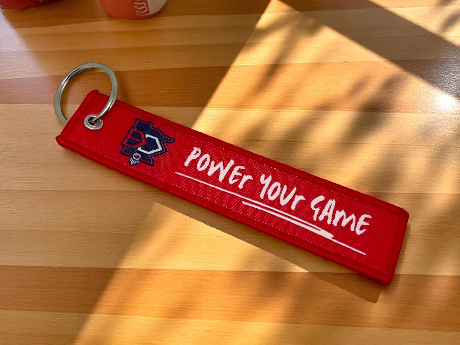 Breloki materiałowe na zamówienie z własnym nadrukiem lub haftem